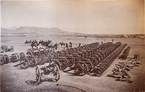 Inspecting captured guns in Afghanistan